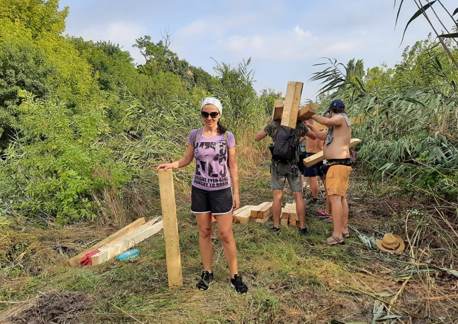 people mooving wooden bars